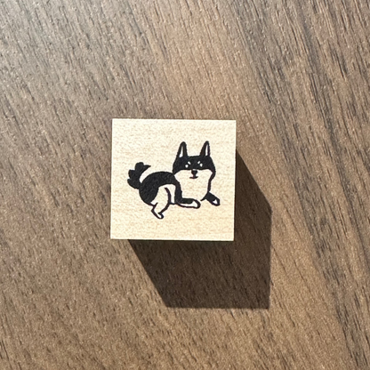 Rubber stamp on a wooden surface with a dog design 
